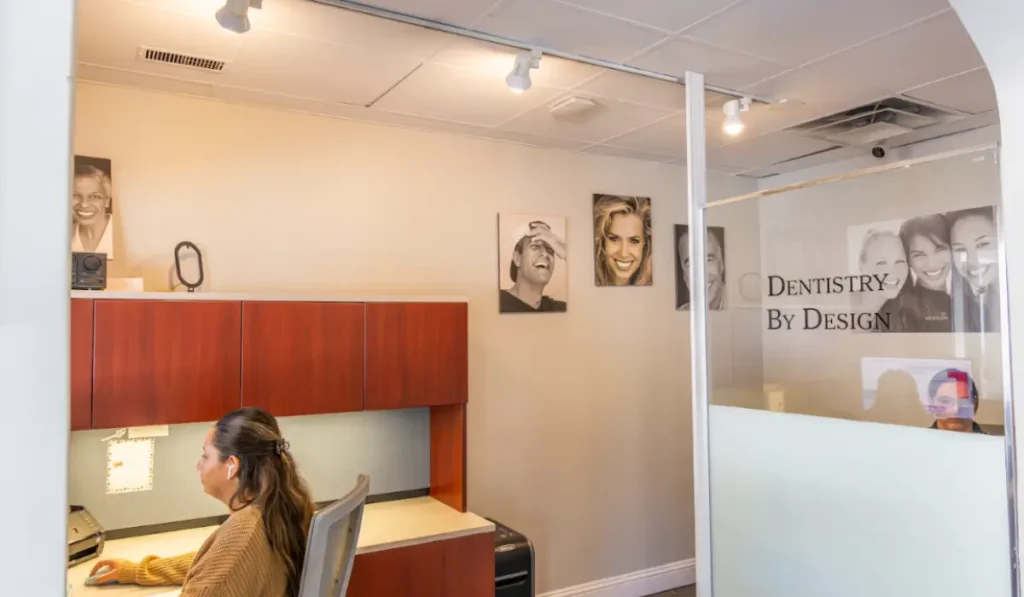 Receptionist assists patient using dental insurance benefits before December 31 in a modern Hinsdale dental office.